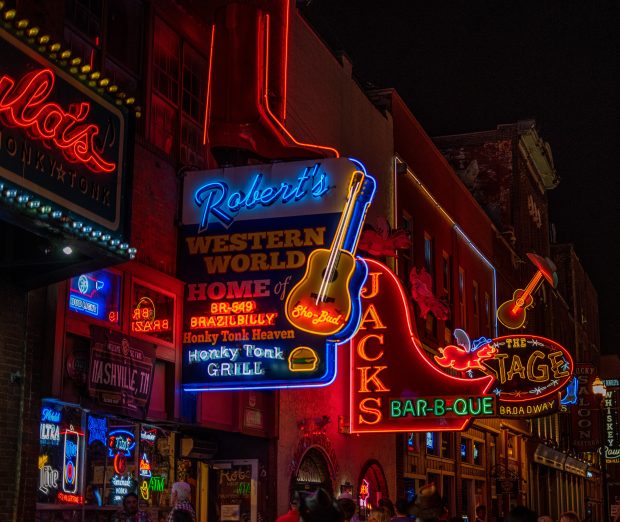 Neon signs light up Nashville at night.